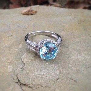Solid sterling silver blue and white topaz ring